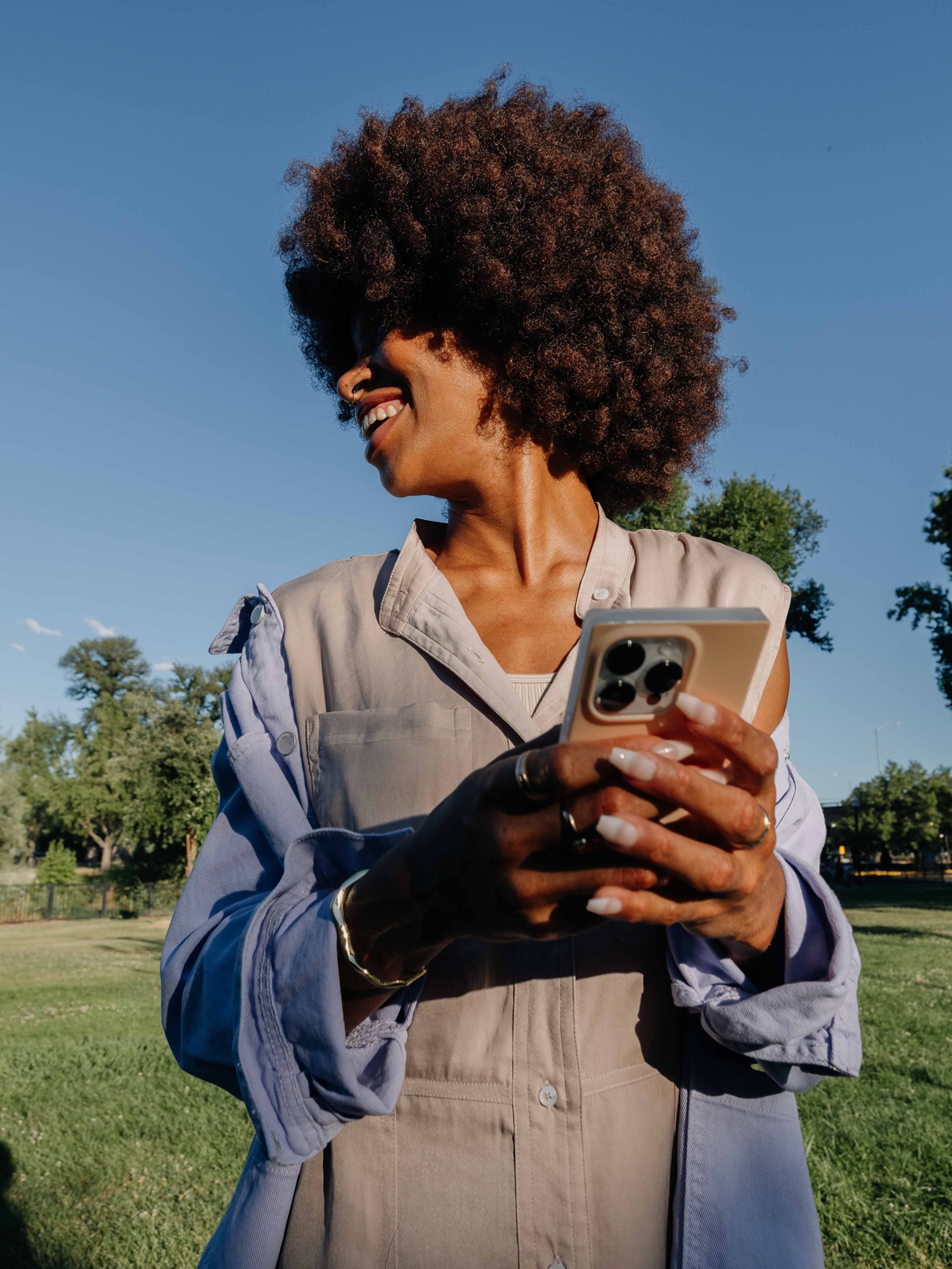 Person holding a smartphone and smiling